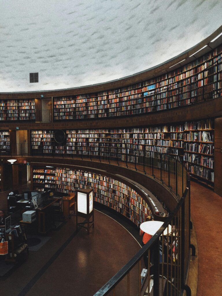 Explore a stunning circular library with endless bookshelves, offering a haven of knowledge and tranquility.